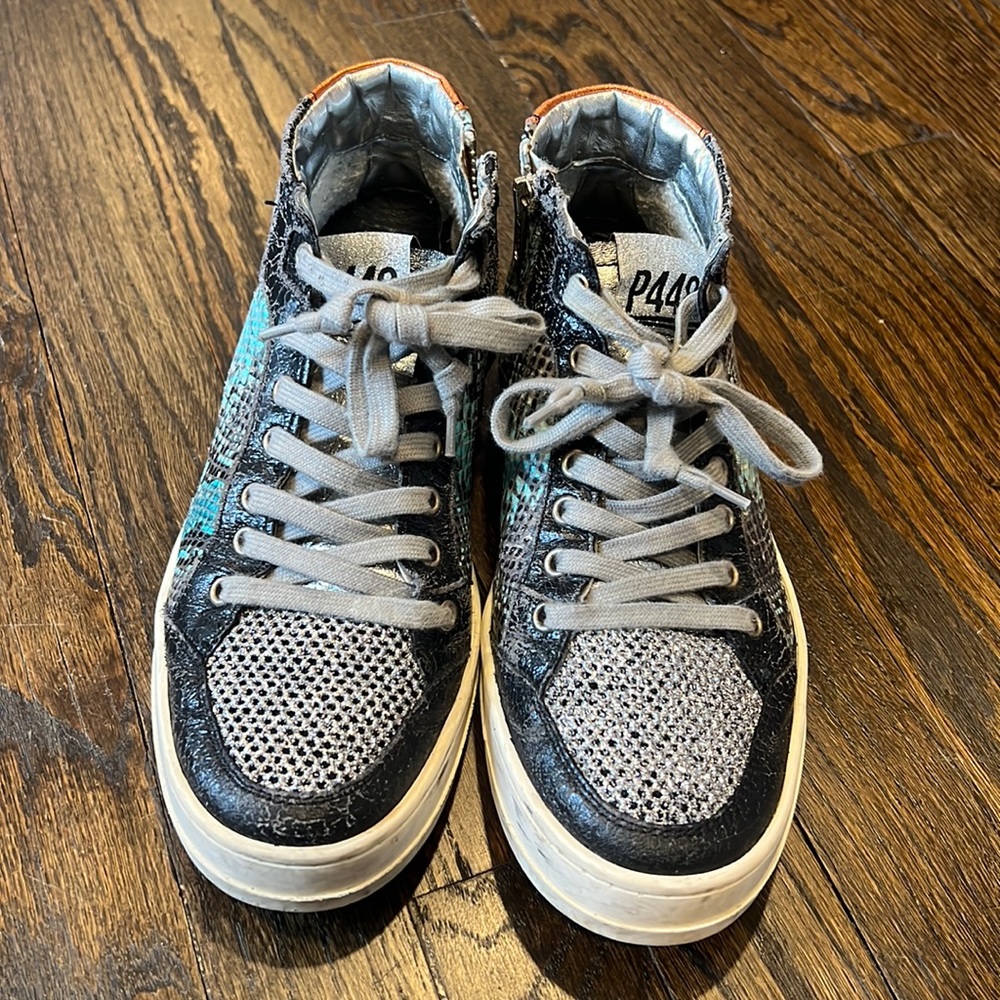 P448 with teal and black snakeskin exterior